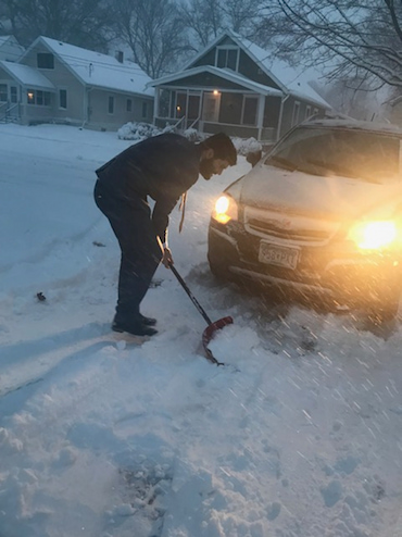 Hasib Sidiqi clearing snow in Minnesota