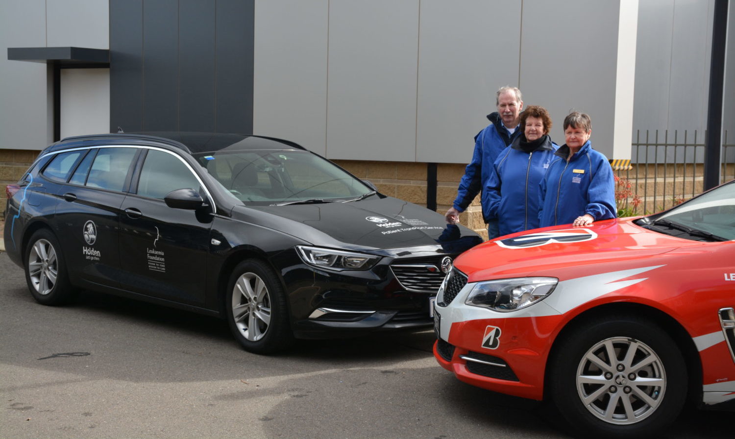 Holden Leukaemia Foundation car with volunteers standing nearby