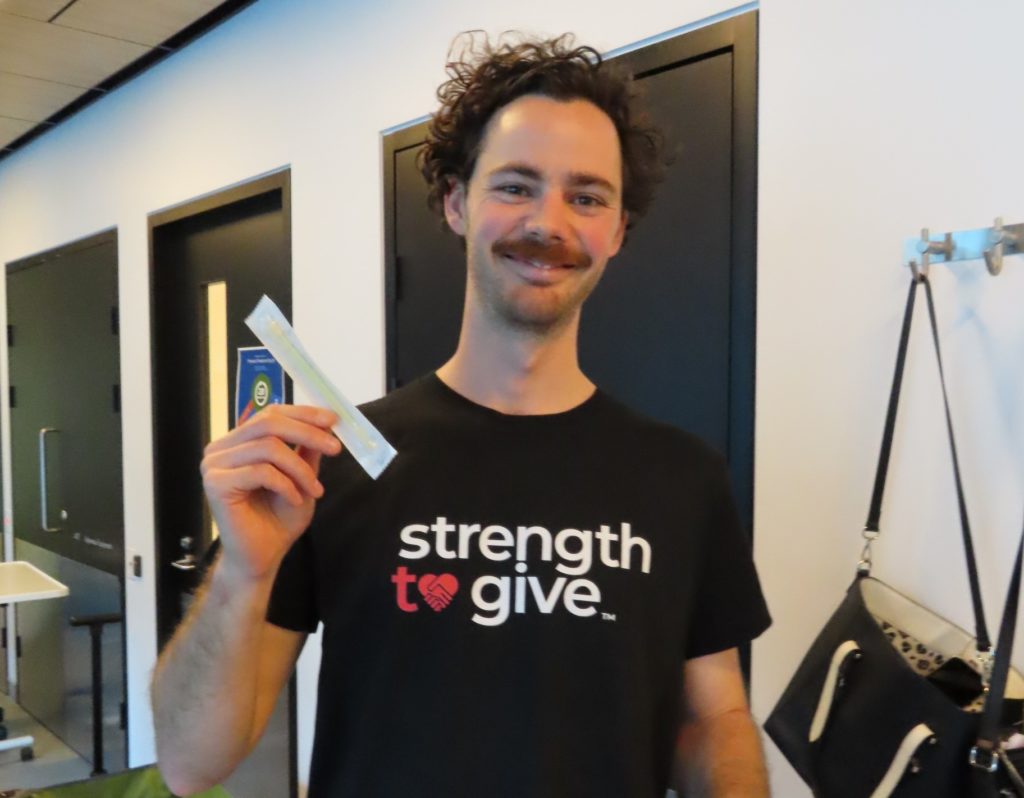 Jack Jacobson holding his swab test kit