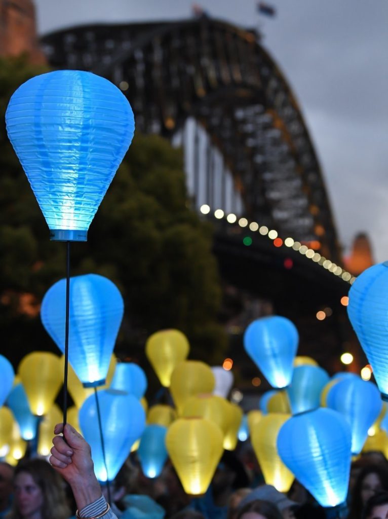 Image of lanterns lit up against a dark night sky