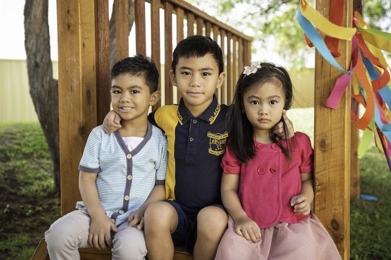 Jacob (far left) with his siblings, Matthew and Erin.