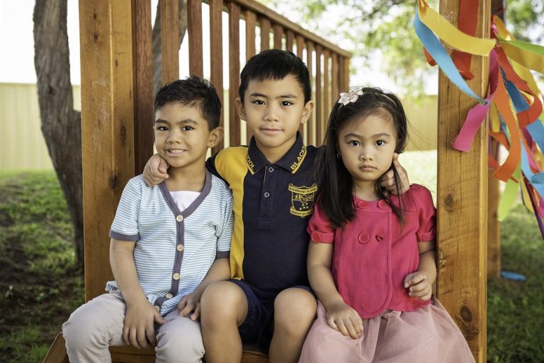 Jacob (far left) with his siblings, Matthew and Erin. 