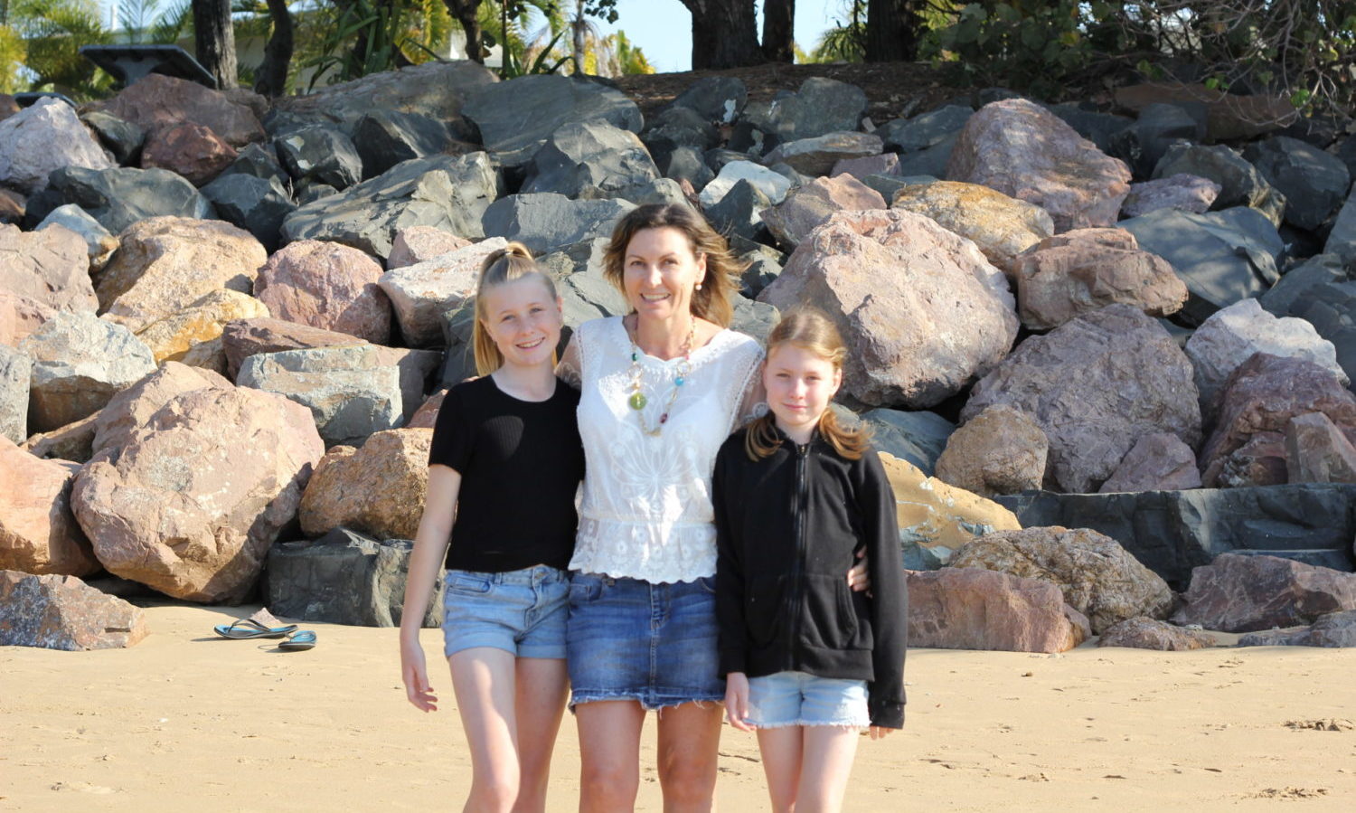 Samantha with her daughters, Jordi and Taylah, on the beach