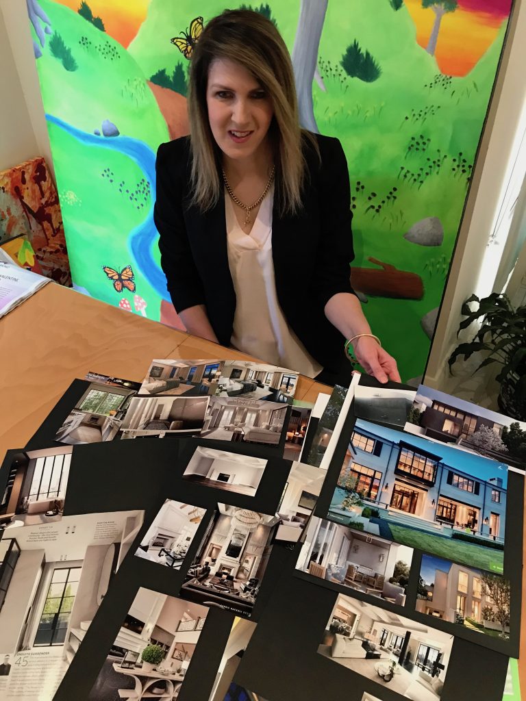 Lisa McNeil with her photobook of ideas for her new home. 