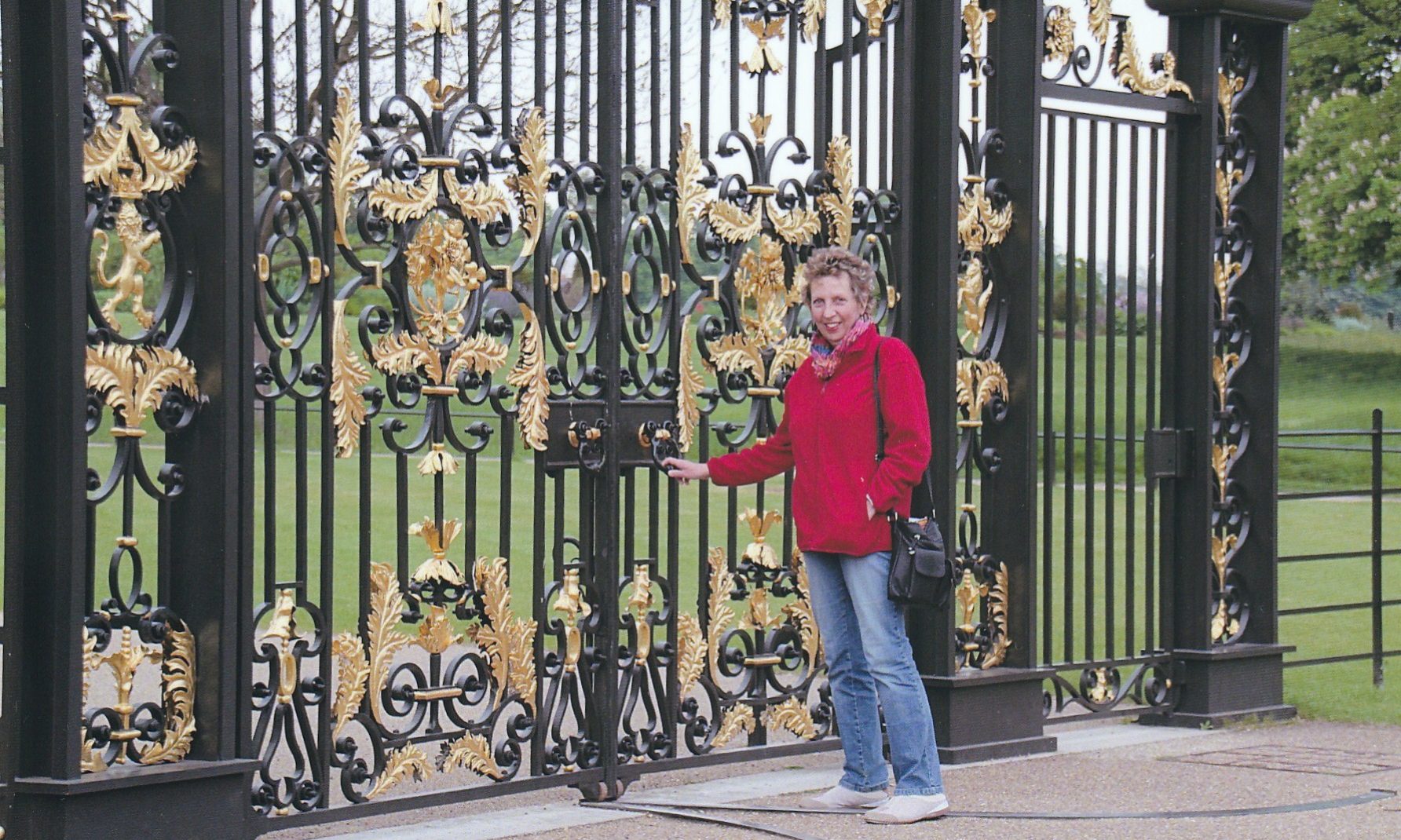 Davina Sickerdick standing outside Buckingham Palace in London