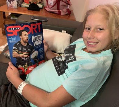 Oren holds a rugby magazine