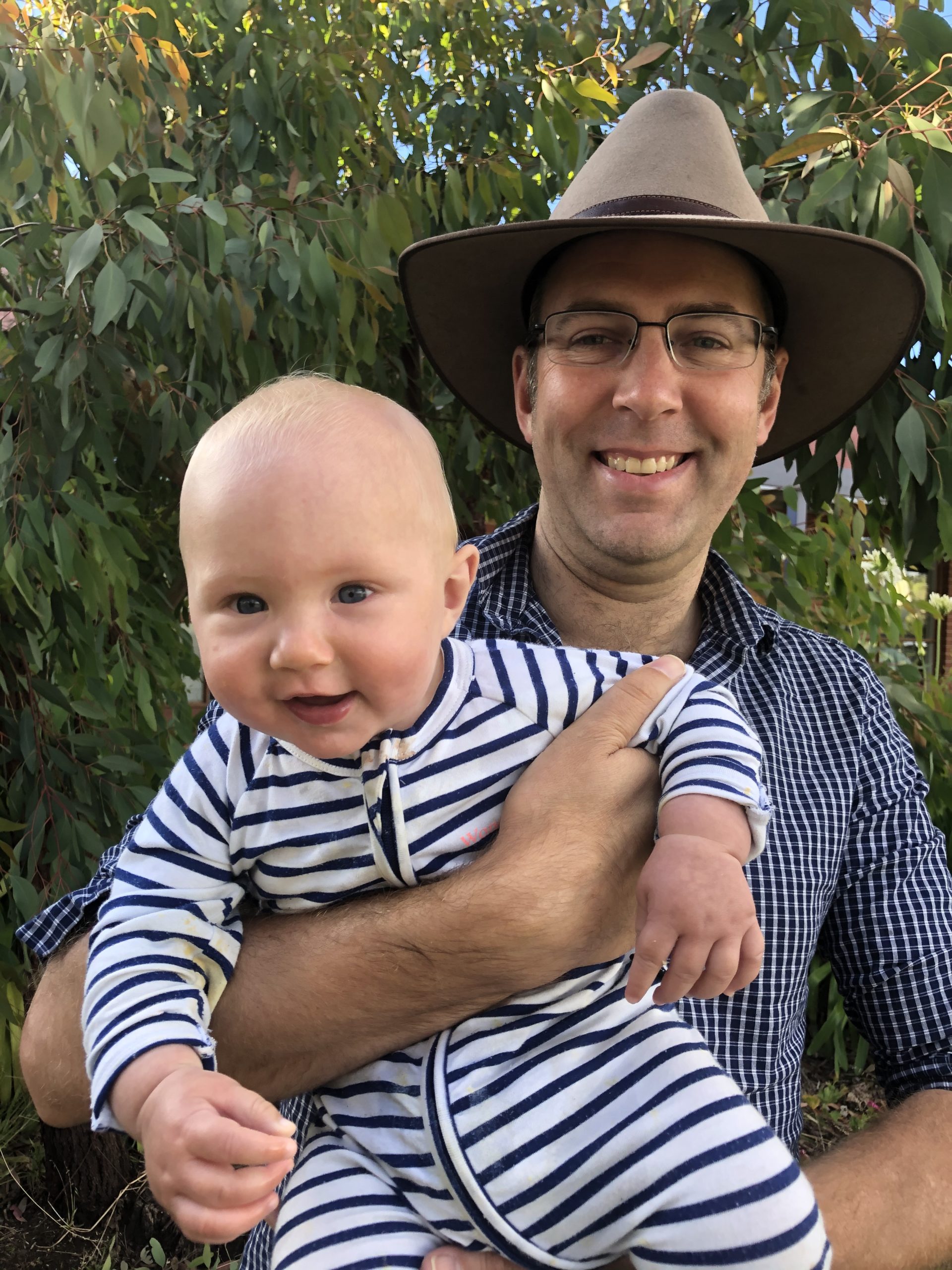 Dr Daniel Thomas with son at the farm