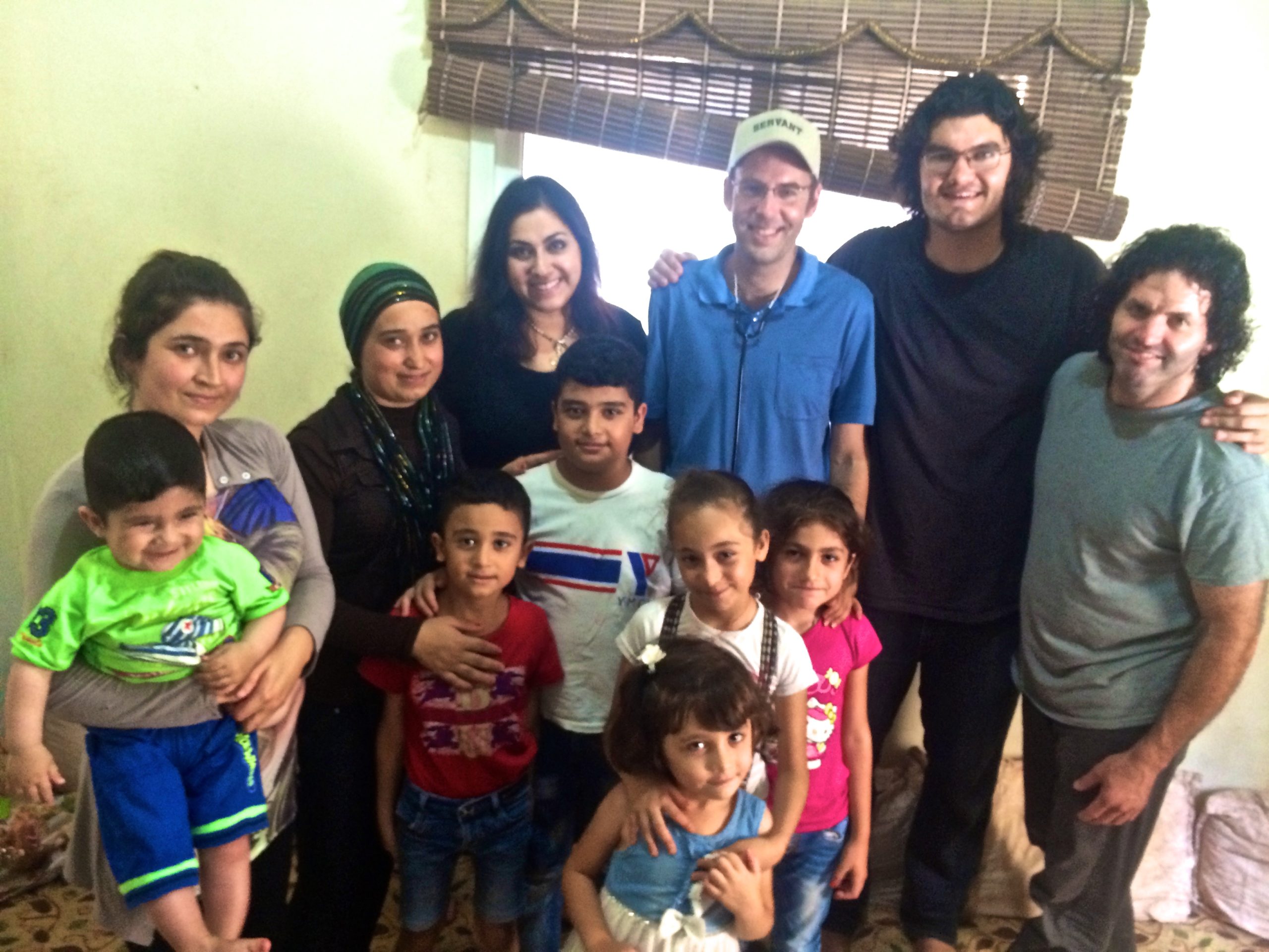 Dr Daniel Thomas with Syrian refugees in Lebanon