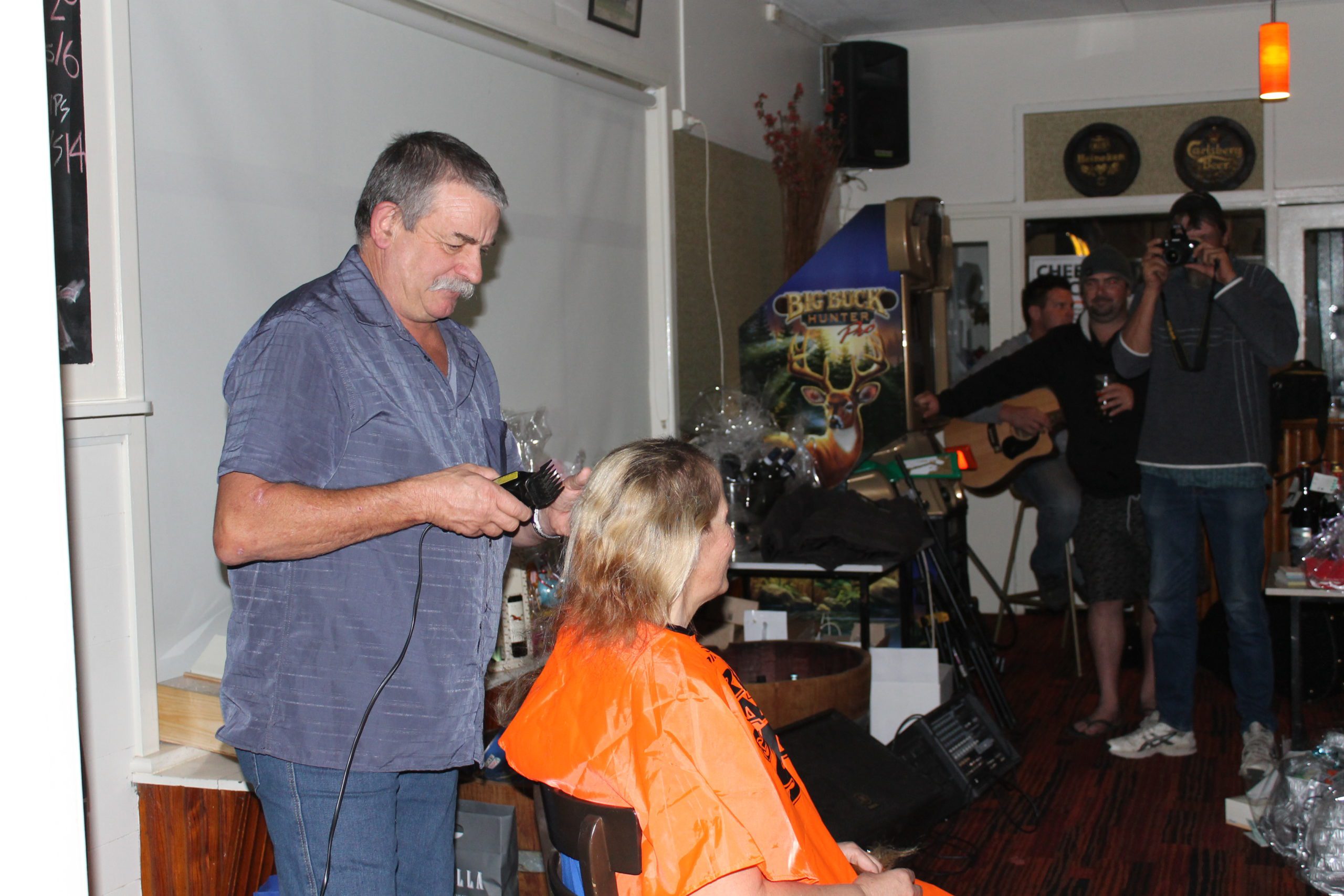 Ted shaving Leanne Pitman's hair at WGS 2013