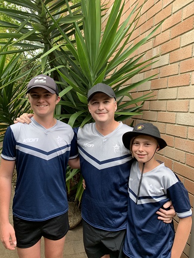 Mark Reid with his two boys, Colby and Charlie in January 2021, before making his return to the touch footy field. 