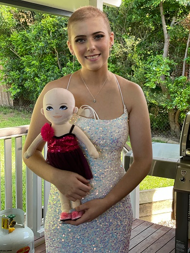 Megan Reid ready for her formal in February 2021 with her Bravery Buddy doll