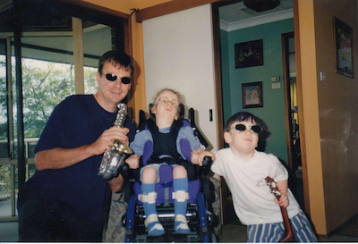 Hugh, aged four, with his sister, Jordan, aged seven, and their father, Stephen