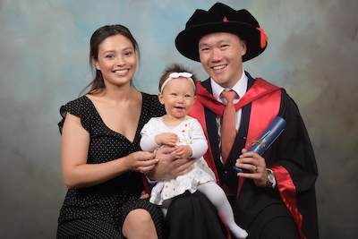 Dr Chun Fong with his wife and daughter