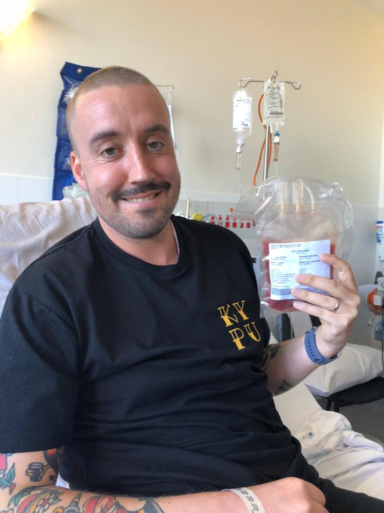 Nick on his bone marrow stem cell transplant day holding stem cells