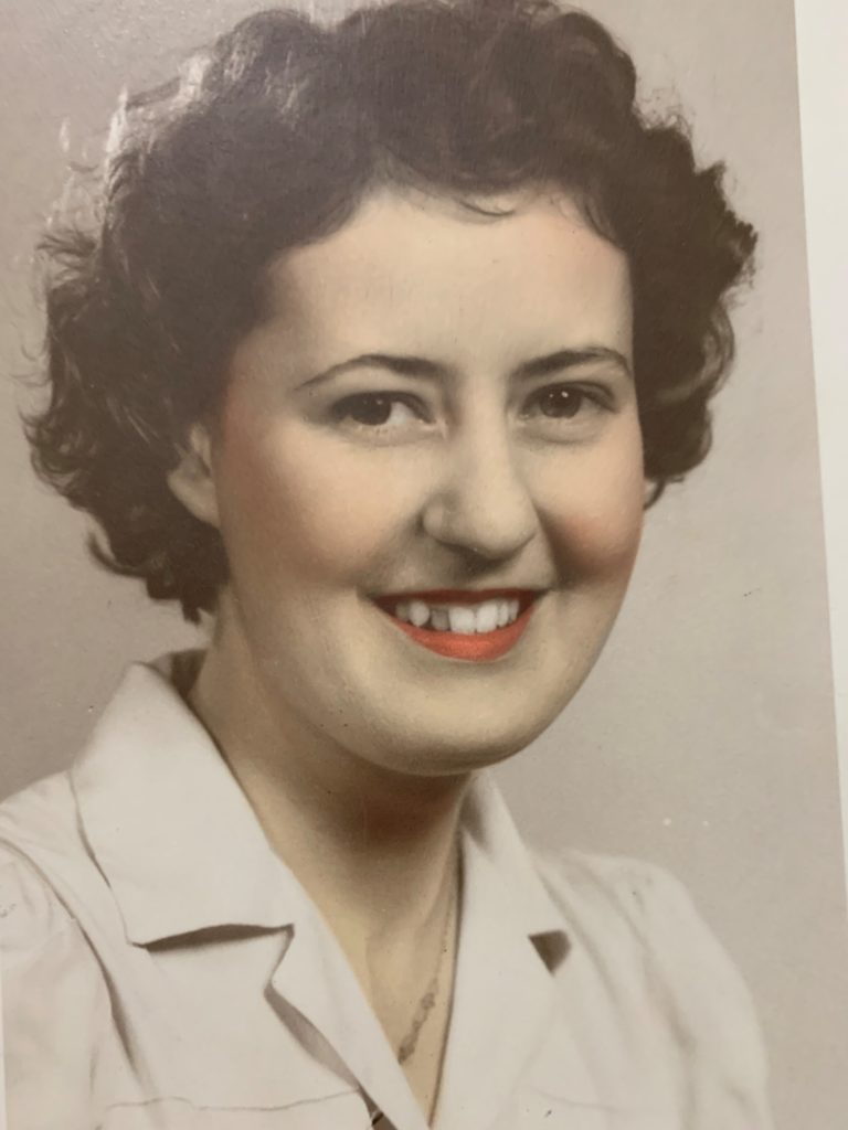 An older photograph of a smiling woman