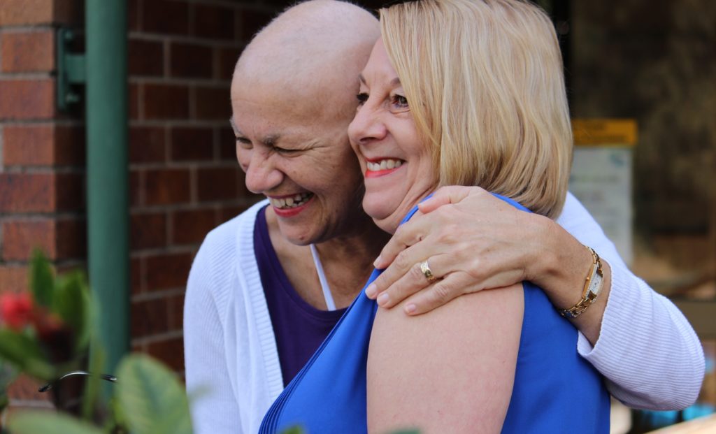 Patient hugging a support worker at a Leukaemia Foundation accommodation centre