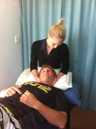 Graeme receiving physiotherapy after surgery