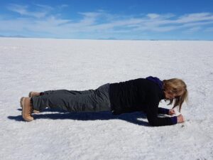 Dr Cecily Forsyth “planking” on the salt flats in Bolivia