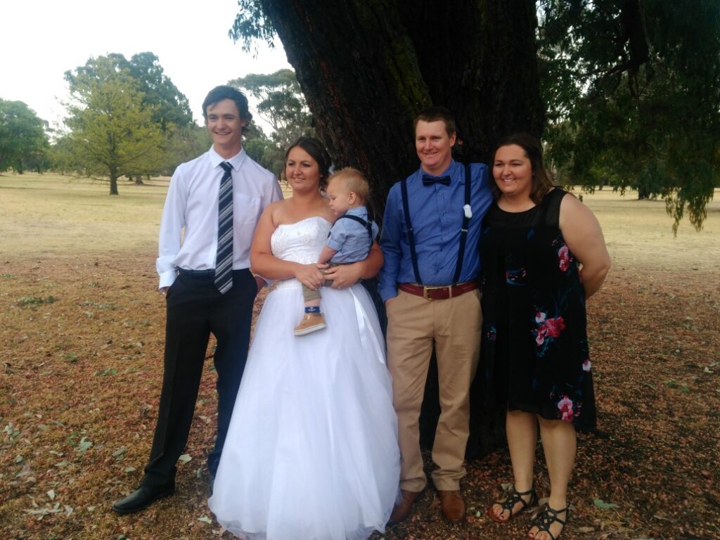 Deyan (far left) with his family