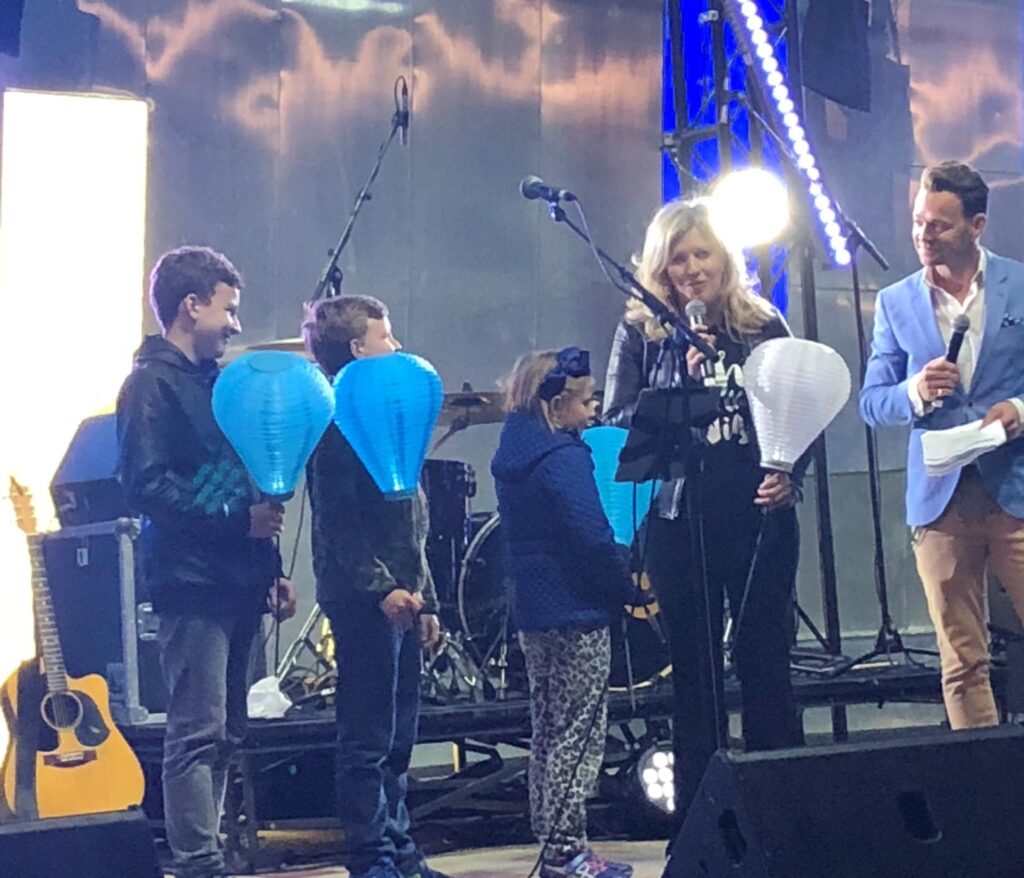 Deborah with her three children at Light the Night at Melbourne’s Federation Square in 2018