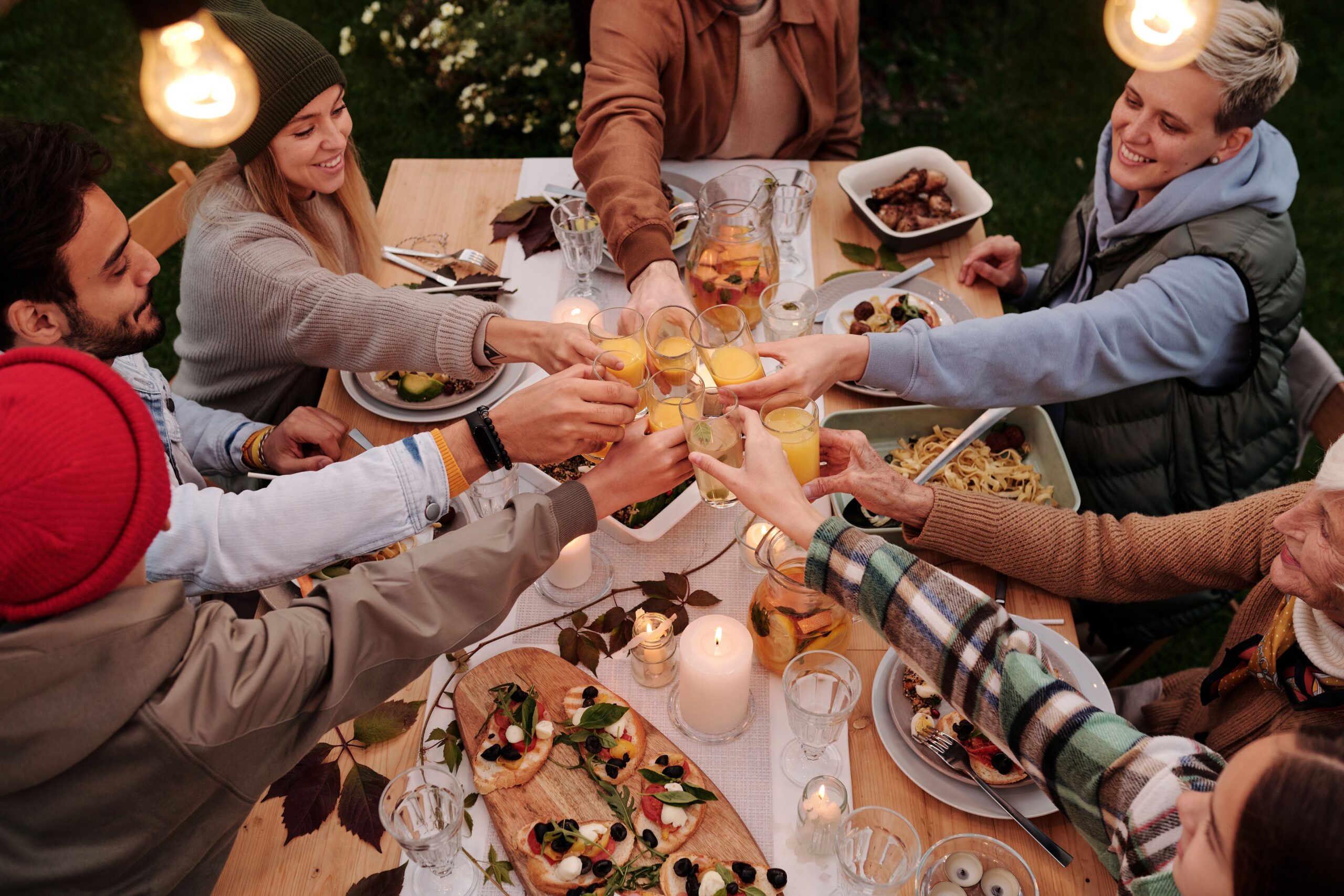 Celebration, Group of friends celebrating at a joyful dining table setting.